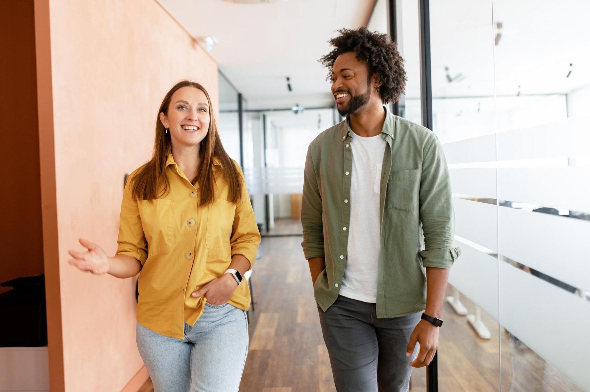 Man and woman walking in office